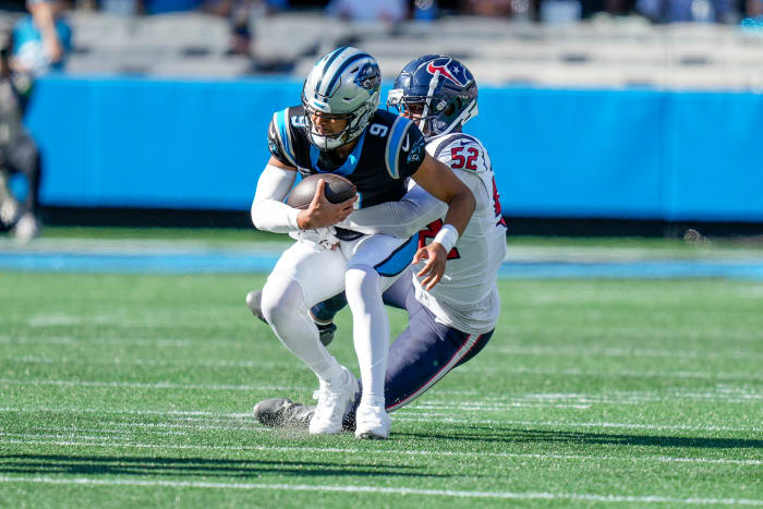 Panthers quarterback Bryce Young (9) is sacked by Houston Texans defensive end Jonathan Greenard (52) during the second half at Bank of America Stadium.